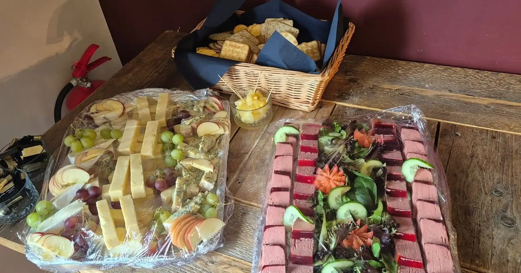 Sandwiches and cakes covered in cling film