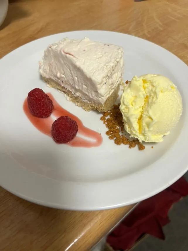 Vanilla cheesecake, raspberries and ice cream.