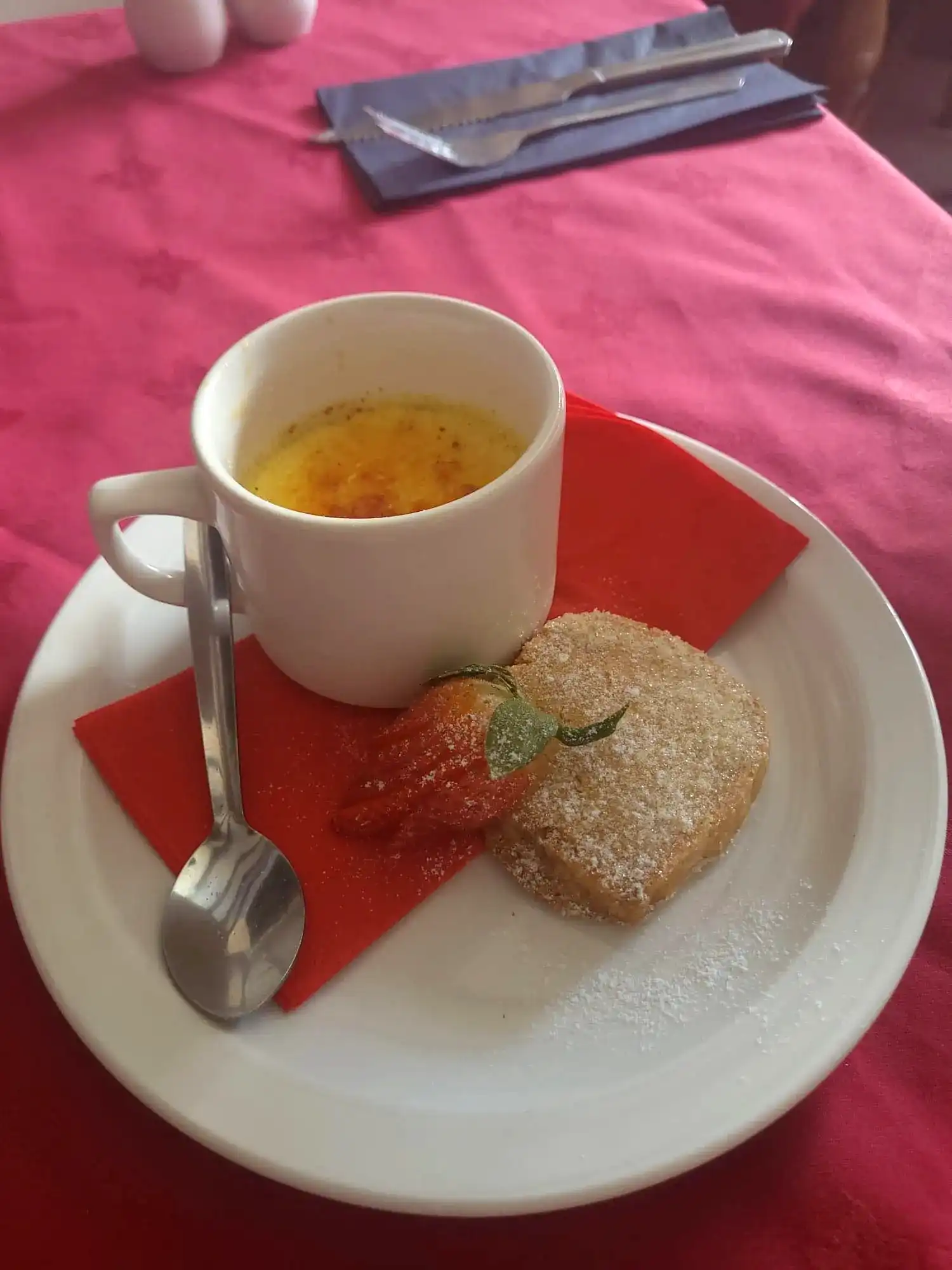 A white plate topped with a tea and cake.
