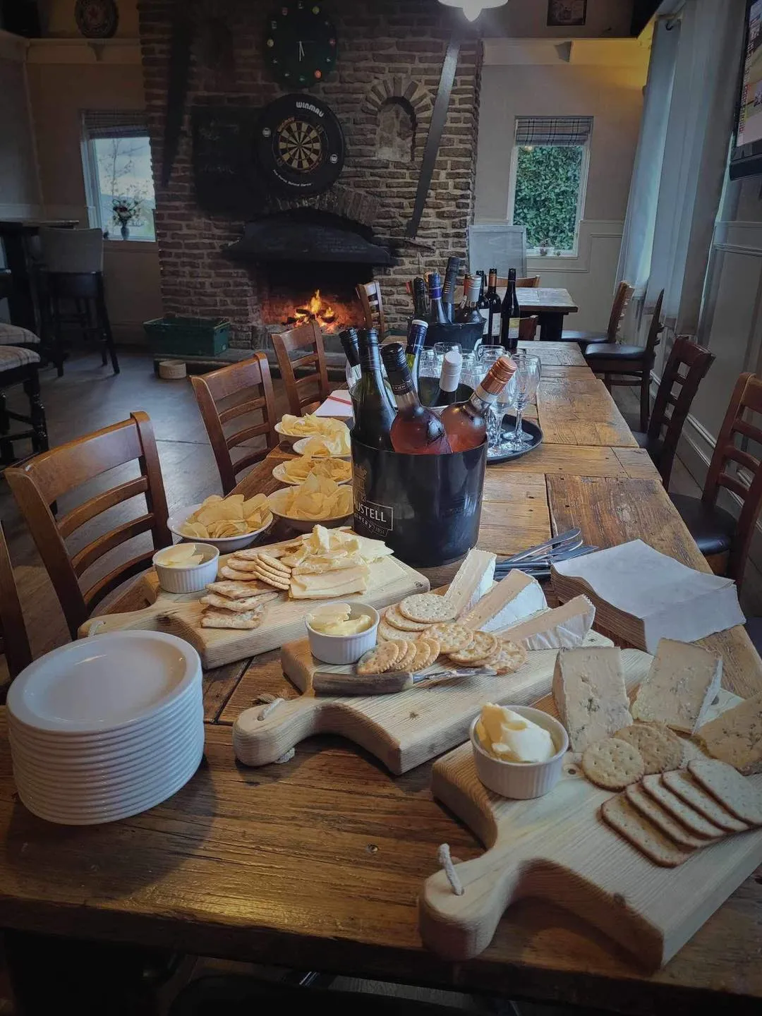 A wooden table topped with lots of food.