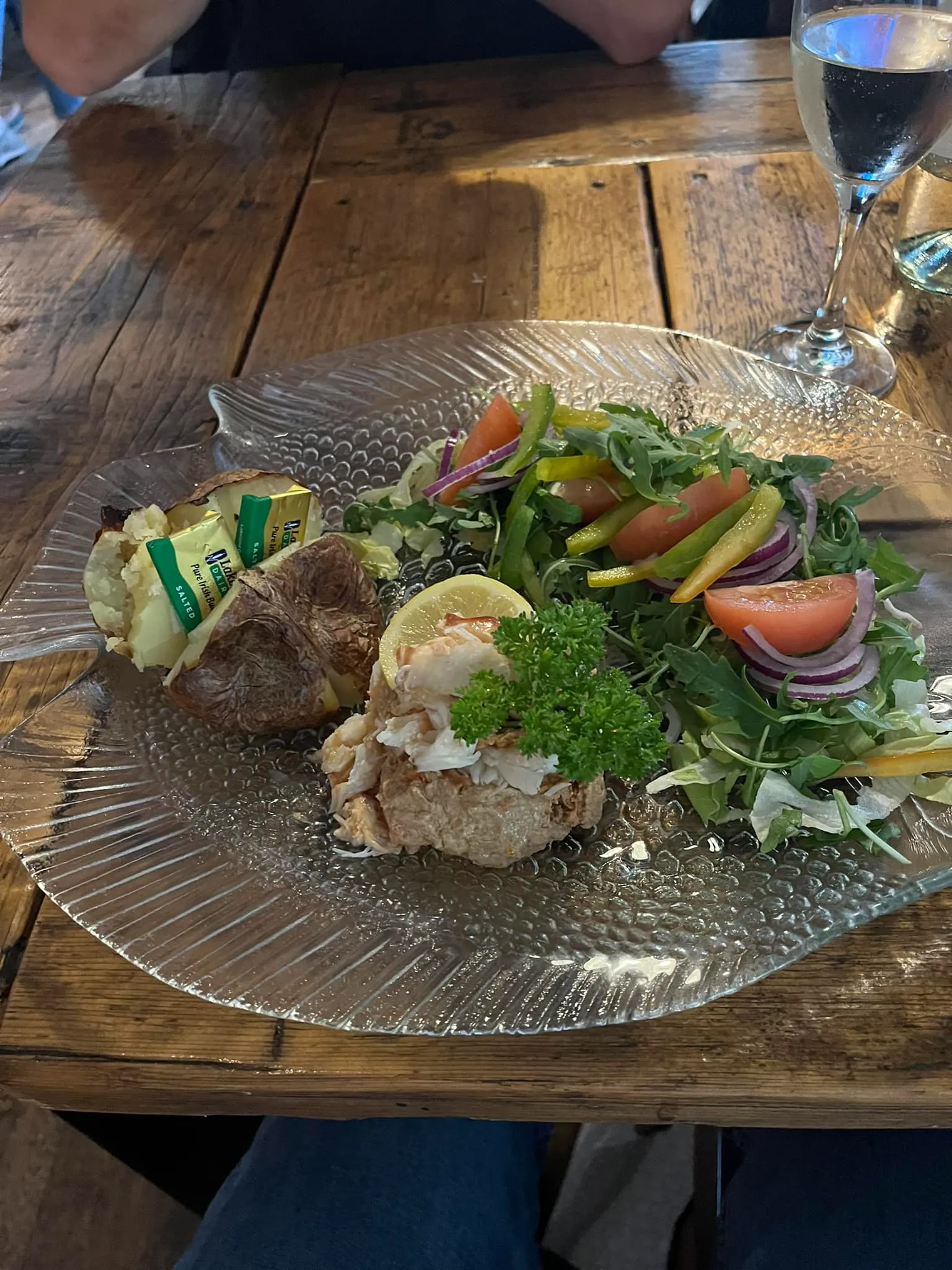 A plate of food on a wooden table.