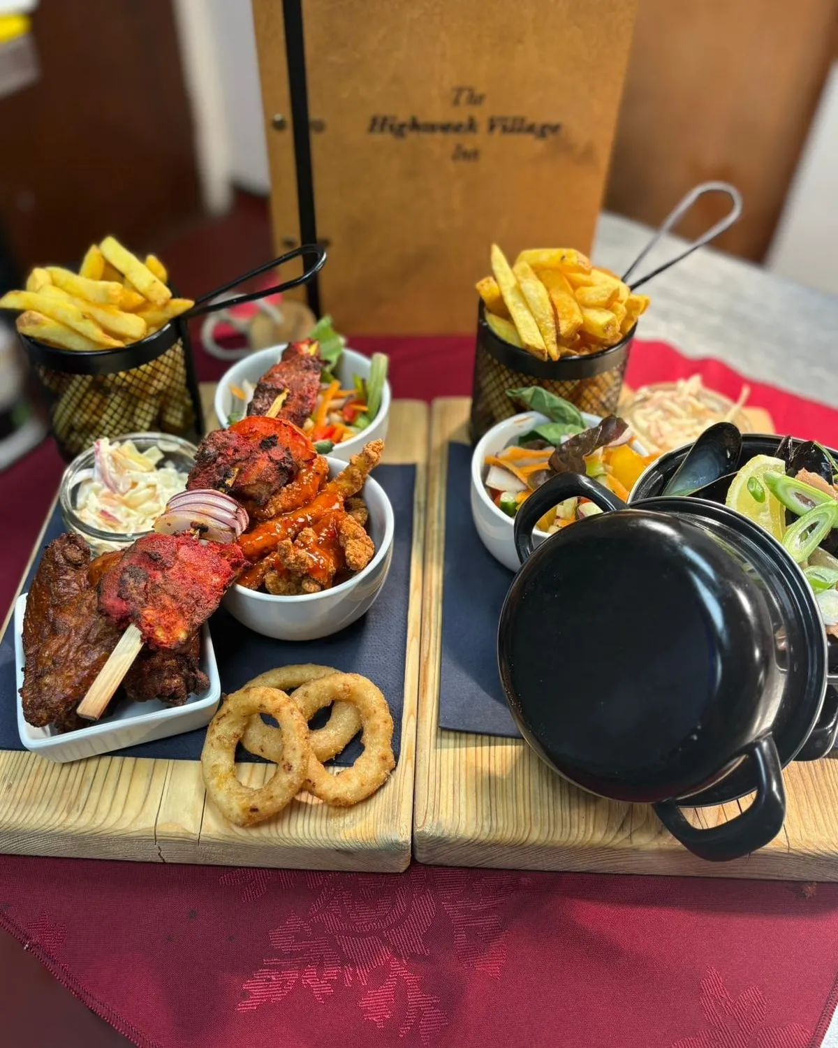 A wooden tray topped with different types of food.